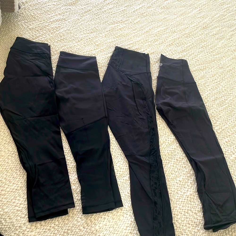 Assortment of lululemon yoga pants with mesh cutout in black sizes 4,8